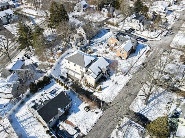 snowy aerial view featuring a residential view