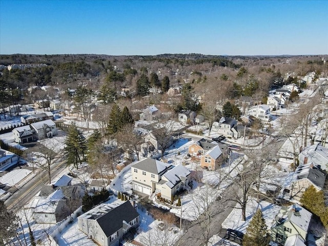 snowy aerial view featuring a residential view