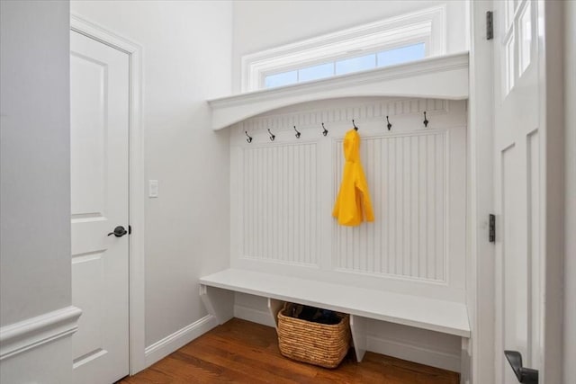 mudroom featuring baseboards and wood finished floors