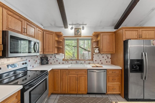 kitchen with backsplash, open shelves, appliances with stainless steel finishes, and a sink