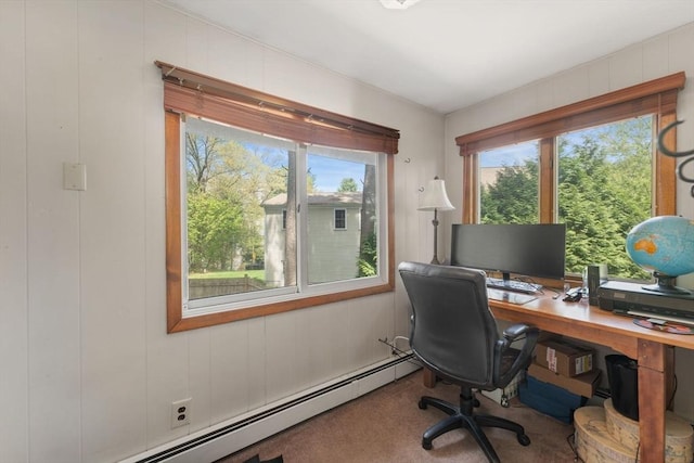 carpeted office with a baseboard heating unit