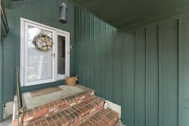 doorway to property with board and batten siding