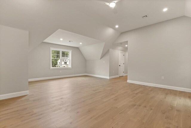 kitchen with white cabinetry, light hardwood / wood-style floors, and a healthy amount of sunlight