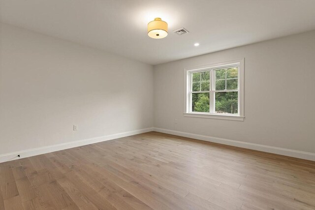 additional living space featuring light hardwood / wood-style floors, vaulted ceiling, and ceiling fan