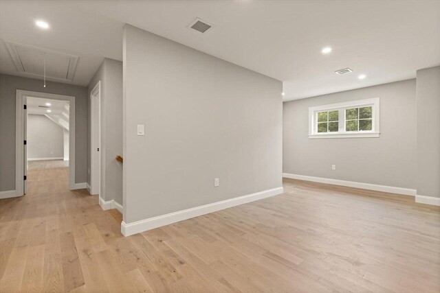 bonus room featuring light wood-type flooring and vaulted ceiling