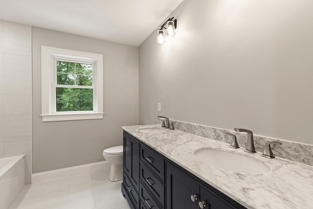 bathroom featuring vanity, toilet, a bath, and tile patterned floors