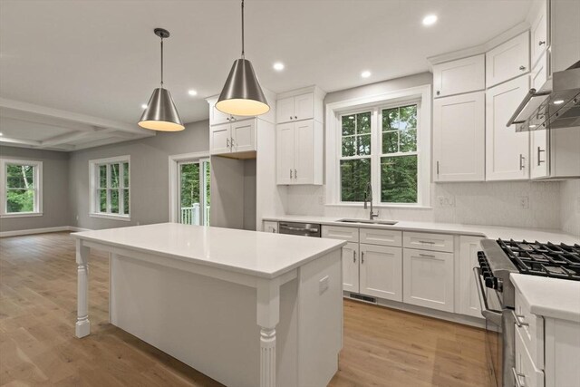 empty room with light hardwood / wood-style floors, french doors, and crown molding