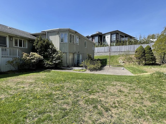 view of yard featuring a patio and fence