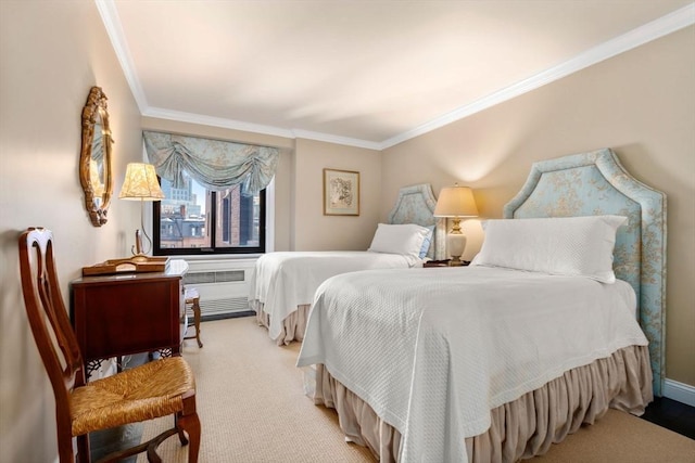 bedroom with crown molding, light colored carpet, and radiator heating unit