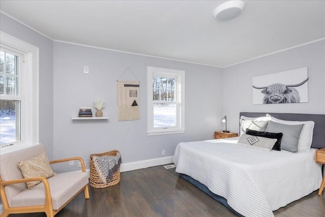 bedroom featuring dark hardwood / wood-style floors and ornamental molding