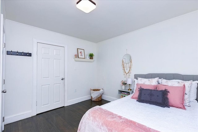 bedroom with dark hardwood / wood-style flooring