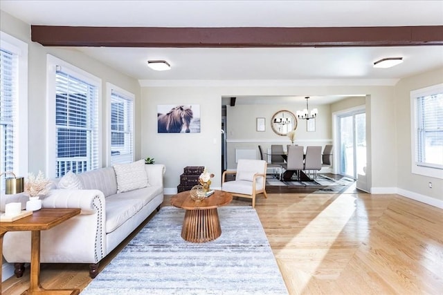 living room featuring light hardwood / wood-style flooring and a chandelier