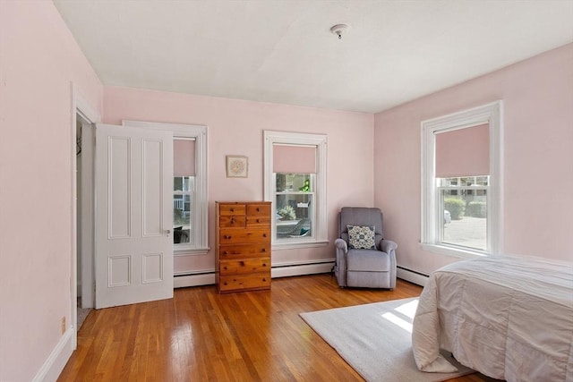 19 Franklin St, Wakefield, MA 01880 - bedroom with a baseboard heating unit and wood finished floors