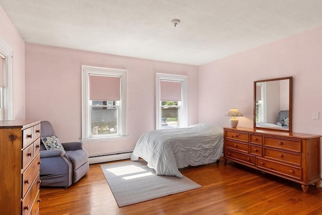 19 Franklin St, Wakefield, MA 01880 - bedroom featuring baseboard heating and wood finished floors
