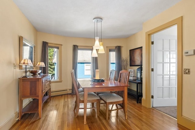 19 Franklin St, Wakefield, MA 01880 - dining room with light wood-style floors and baseboard heating