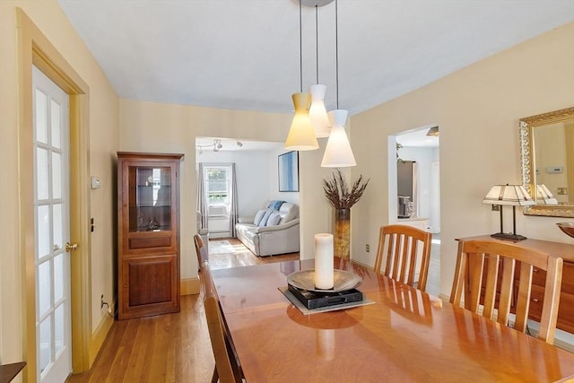 19 Franklin St, Wakefield, MA 01880 - dining space with light wood-style flooring and baseboards
