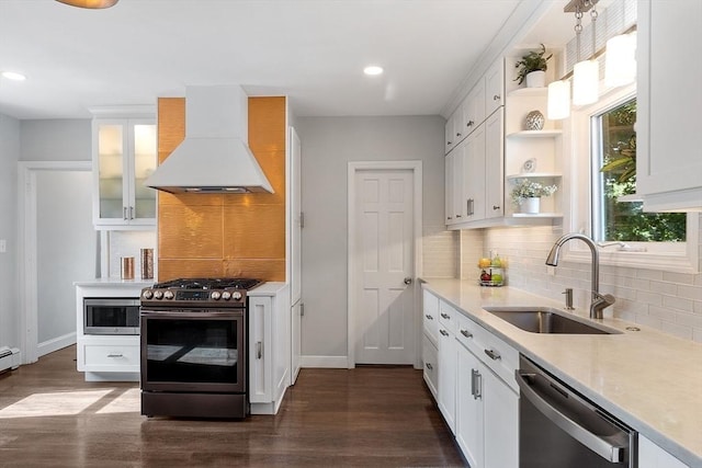 19 Franklin St, Wakefield, MA 01880 - kitchen with appliances with stainless steel finishes, premium range hood, open shelves, decorative backsplash, and recessed lighting