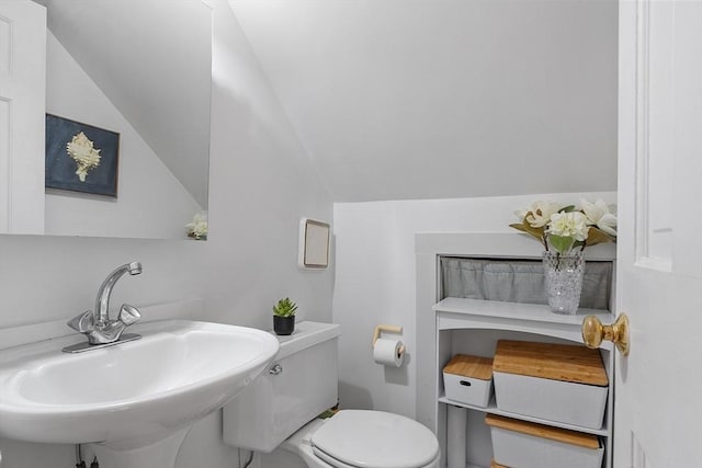 19 Franklin St, Wakefield, MA 01880 - half bathroom with a sink and lofted ceiling