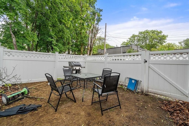 11 Cameron St Unit 1, Brookline, MA 02445 - fenced backyard with a gate, grilling area, and outdoor dining space