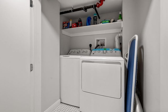 11 Cameron St Unit 1, Brookline, MA 02445 - laundry room with independent washer and dryer, baseboards, and light floors