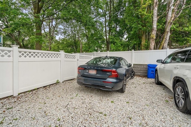 11 Cameron St Unit 1, Brookline, MA 02445 - view of parking with view of wooded area