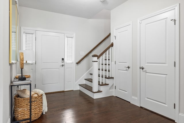 foyer with dark hardwood / wood-style floors