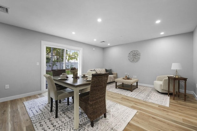 dining space with light wood-type flooring