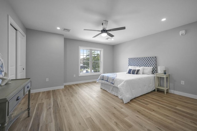 bedroom featuring hardwood / wood-style flooring and ceiling fan