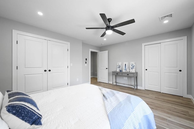 bedroom with ceiling fan and light hardwood / wood-style floors