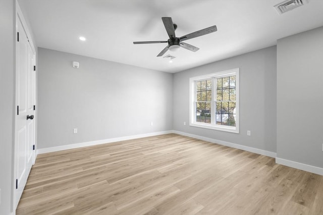 unfurnished room featuring ceiling fan and light wood-type flooring