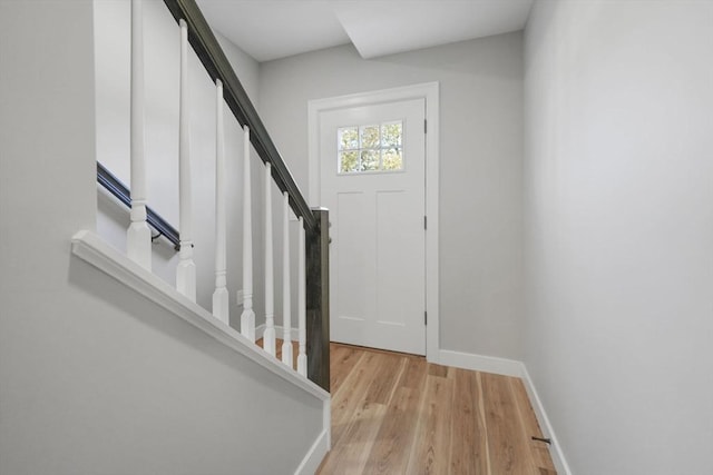 foyer entrance with light wood-type flooring