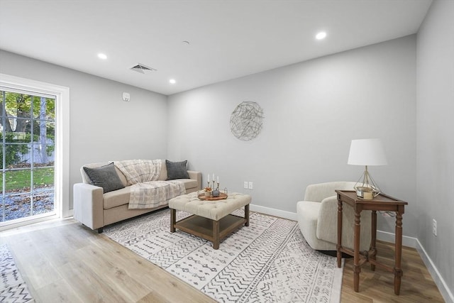 living room with light hardwood / wood-style floors