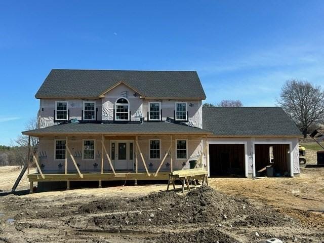view of front of home with an attached garage and covered porch