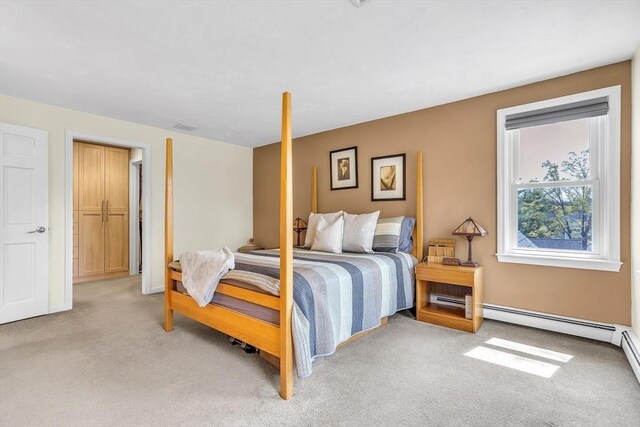 bedroom featuring baseboards and light carpet