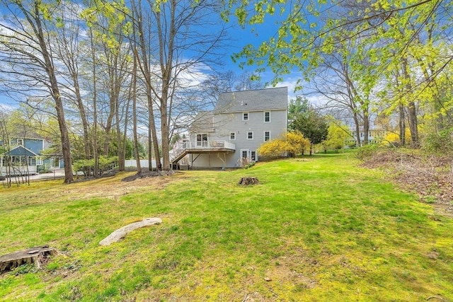 view of yard with a deck and stairway