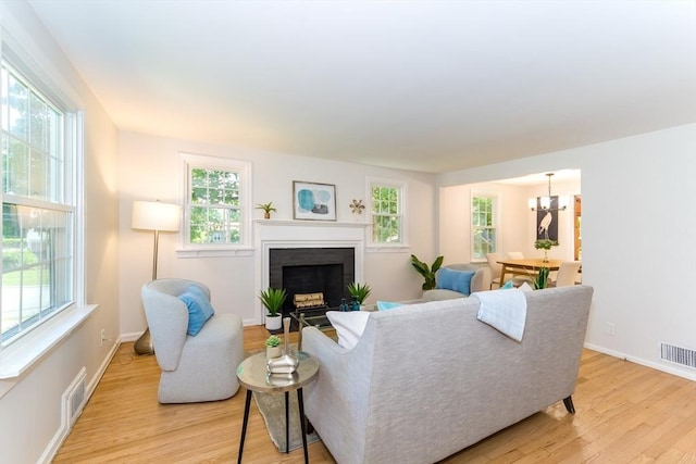 6 Macarthur Rd, Natick, MA 01760 - living room with light wood finished floors and a fireplace