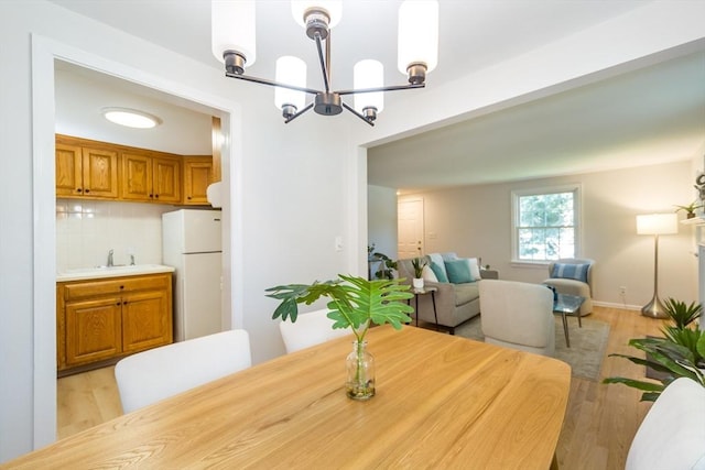 6 Macarthur Rd, Natick, MA 01760 - dining area with a chandelier and light wood-type flooring