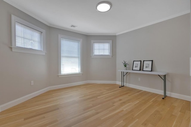 24-26 Bentley St, Boston, MA 02135 - spare room with light wood-style flooring and ornamental molding