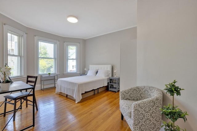 24-26 Bentley St, Boston, MA 02135 - bedroom with ornamental molding and light wood-style flooring