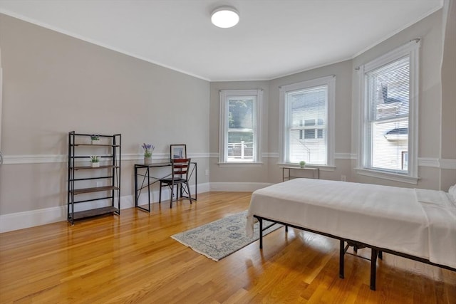 24-26 Bentley St, Boston, MA 02135 - bedroom featuring light wood finished floors, multiple windows, and ornamental molding
