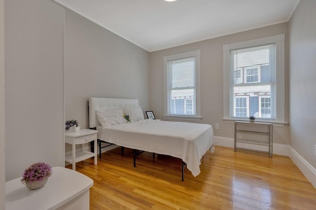 24-26 Bentley St, Boston, MA 02135 - bedroom with ornamental molding and light wood-type flooring