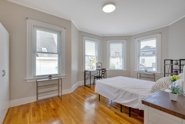 24-26 Bentley St, Boston, MA 02135 - bedroom with crown molding and light wood-type flooring
