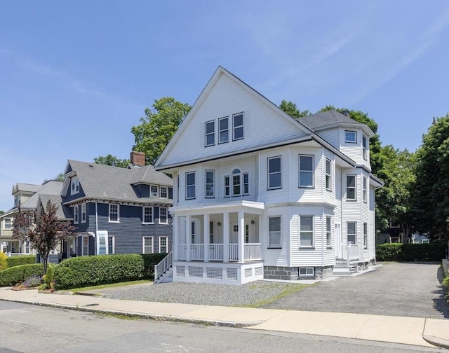 24-26 Bentley St, Boston, MA 02135 - view of front of home with a porch