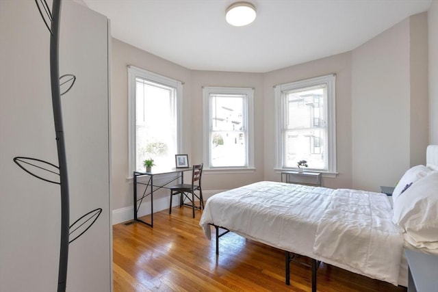 24-26 Bentley St, Boston, MA 02135 - bedroom featuring wood finished floors and baseboards
