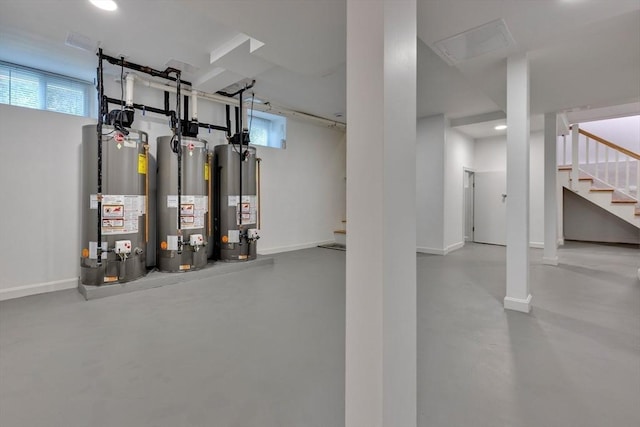 24-26 Bentley St, Boston, MA 02135 - basement featuring water heater, stairs, and recessed lighting
