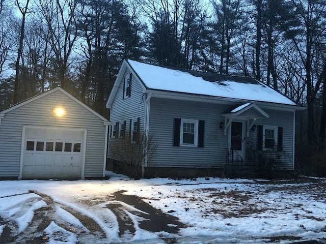 view of front facade featuring a garage and an outdoor structure