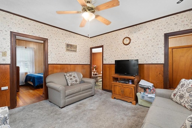 376 N Underwood St, Fall River, MA 02720 - carpeted living room featuring wainscoting, wooden walls, crown molding, and a ceiling fan