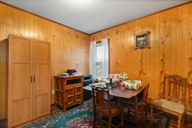 376 N Underwood St, Fall River, MA 02720 - dining room with ornamental molding, wooden walls, and a textured ceiling