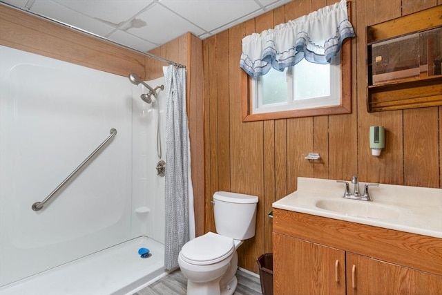 376 N Underwood St, Fall River, MA 02720 - full bathroom featuring vanity, a shower with shower curtain, wooden walls, and wood finished floors