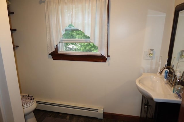 17 Lockwood Ave, Attleboro, MA 02703 - bathroom featuring baseboard heating, vanity, toilet, and baseboards